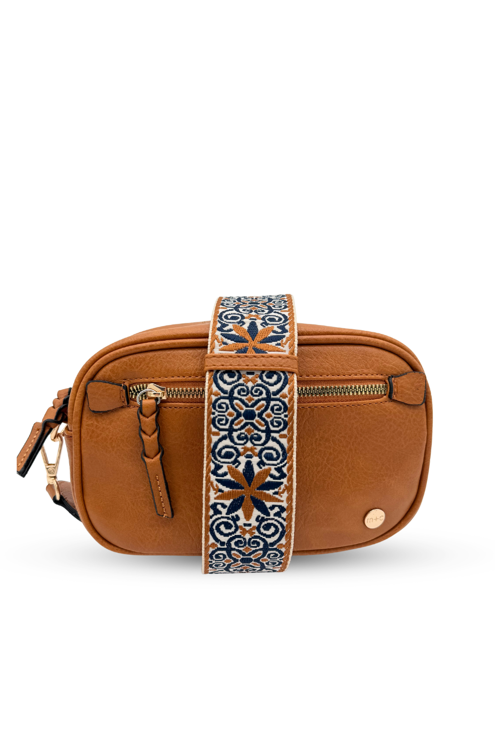Woman wearing white shirt, tan pants and a Modern + Chic Gentry Vegan Leather Crossbody Bag in camel. 